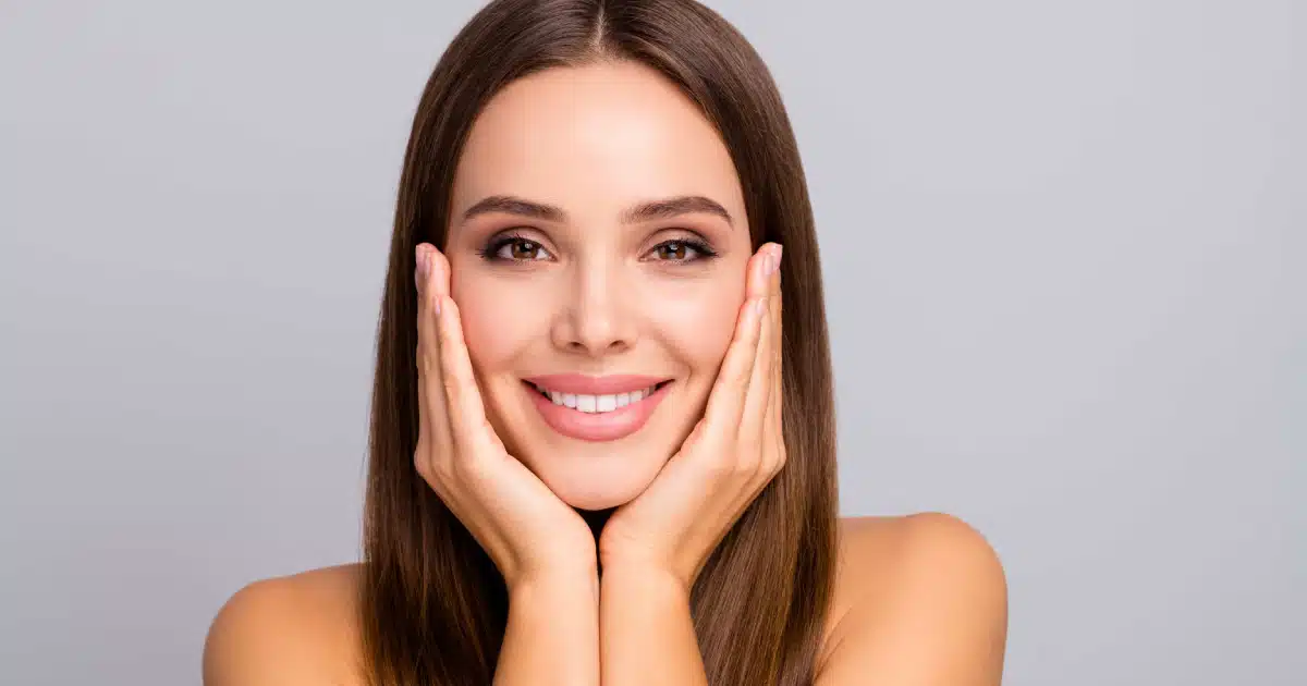 A women showing her glowing face after facial treatment in Waunakee, WI