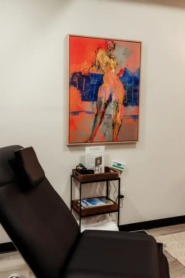 Dermatology Treatment In Waunakee, WI 32 Treatment room cart and wall art at Loure Aesthetics